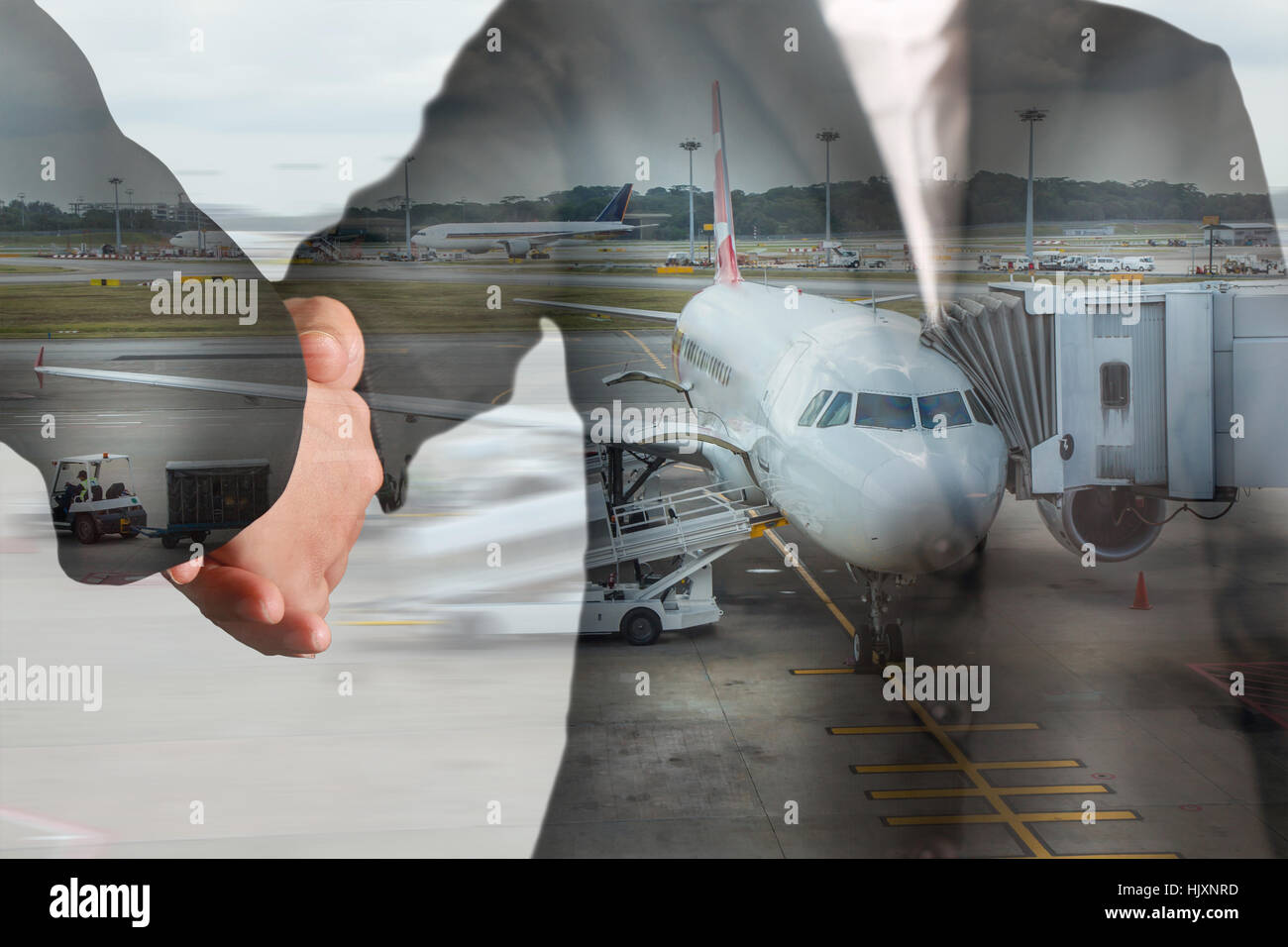 Double exposure of handshake and airport on motion background as partnership and transportation concept. Stock Photo