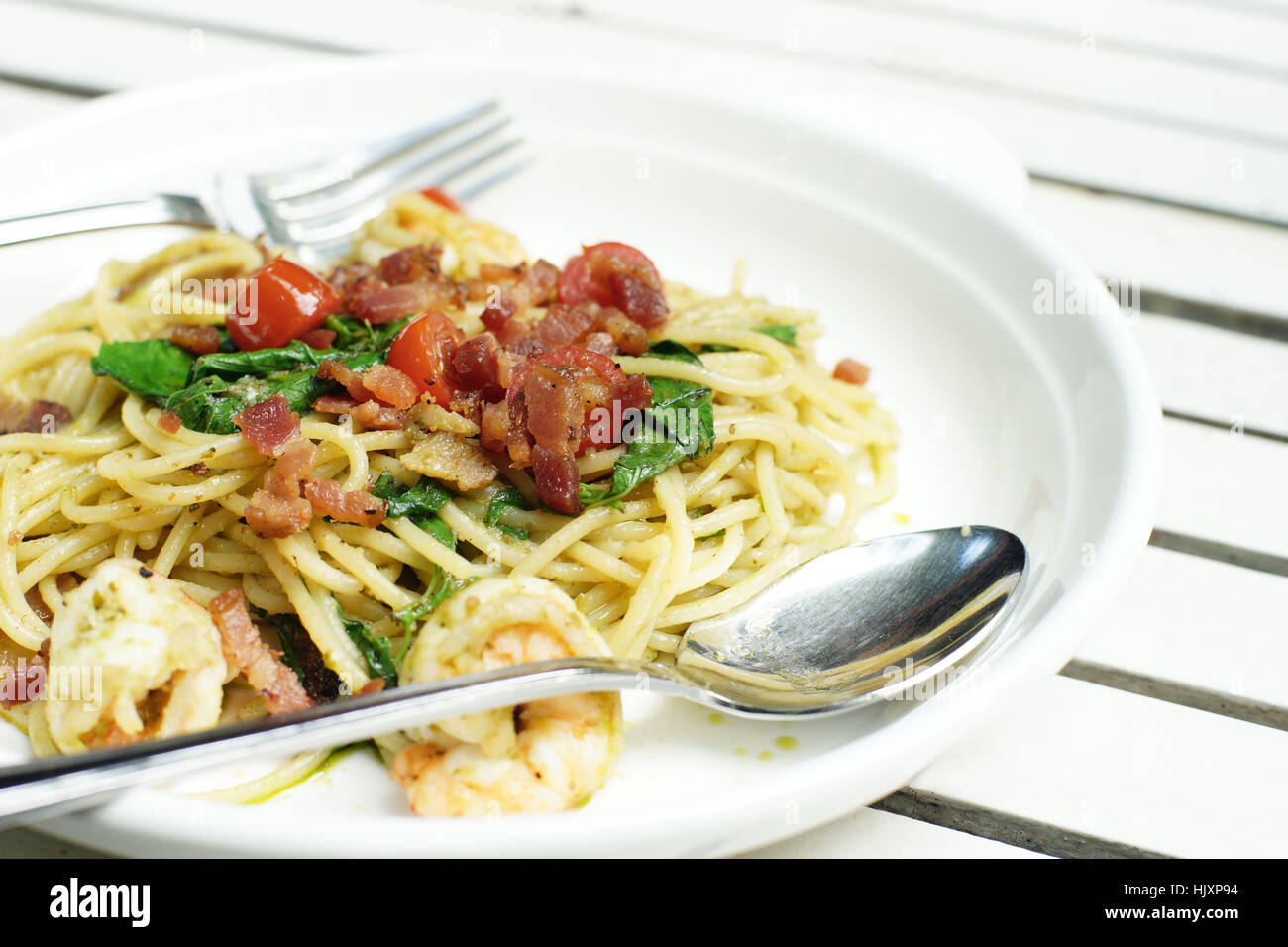 delicious italian spaghetti on white wooden table Stock Photo