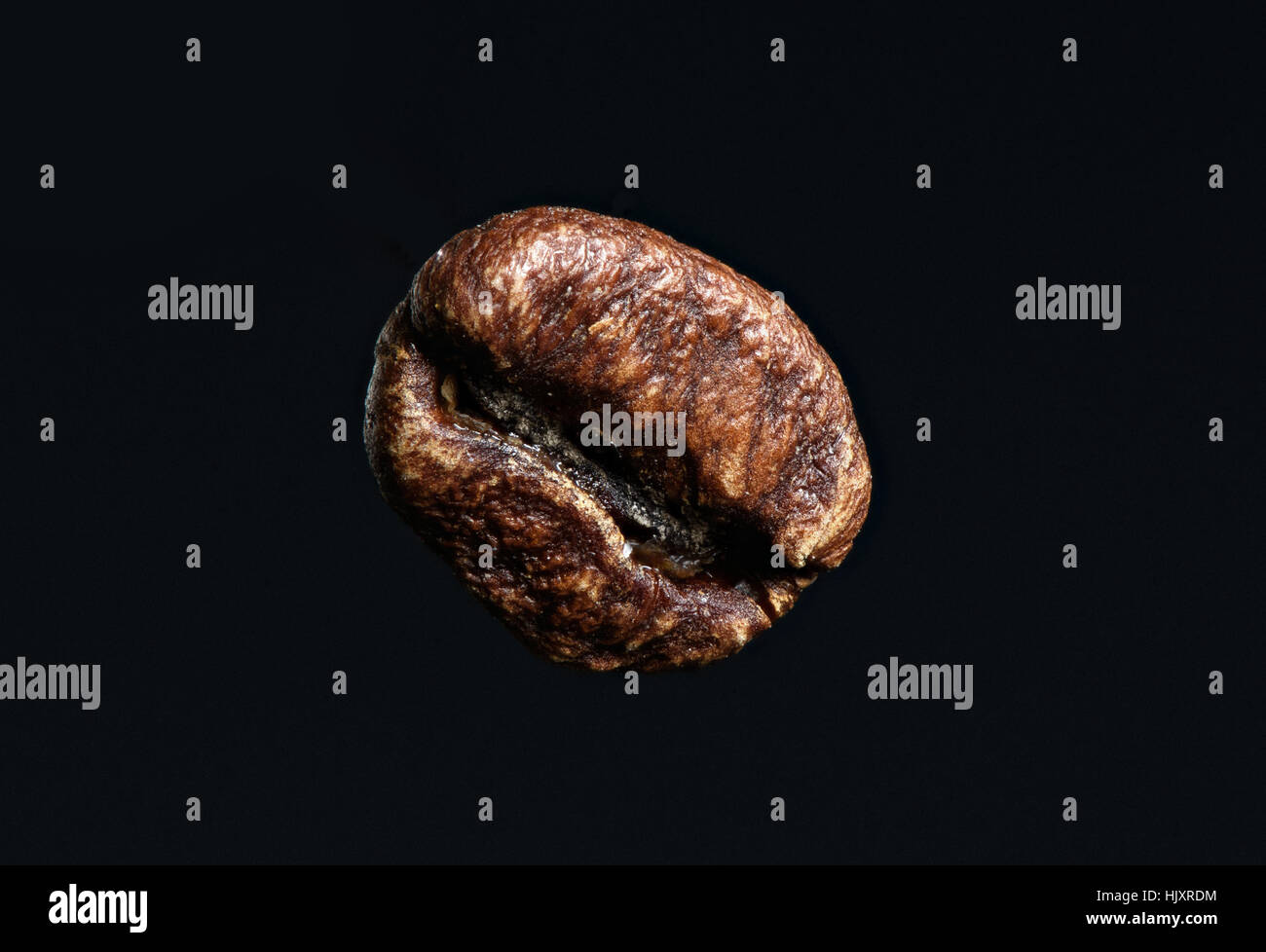 Close up roasted coffee bean. Isolated on black background Stock Photo ...