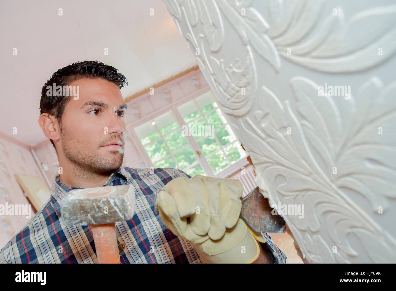 Chiseling away at a wall Stock Photo Alamy