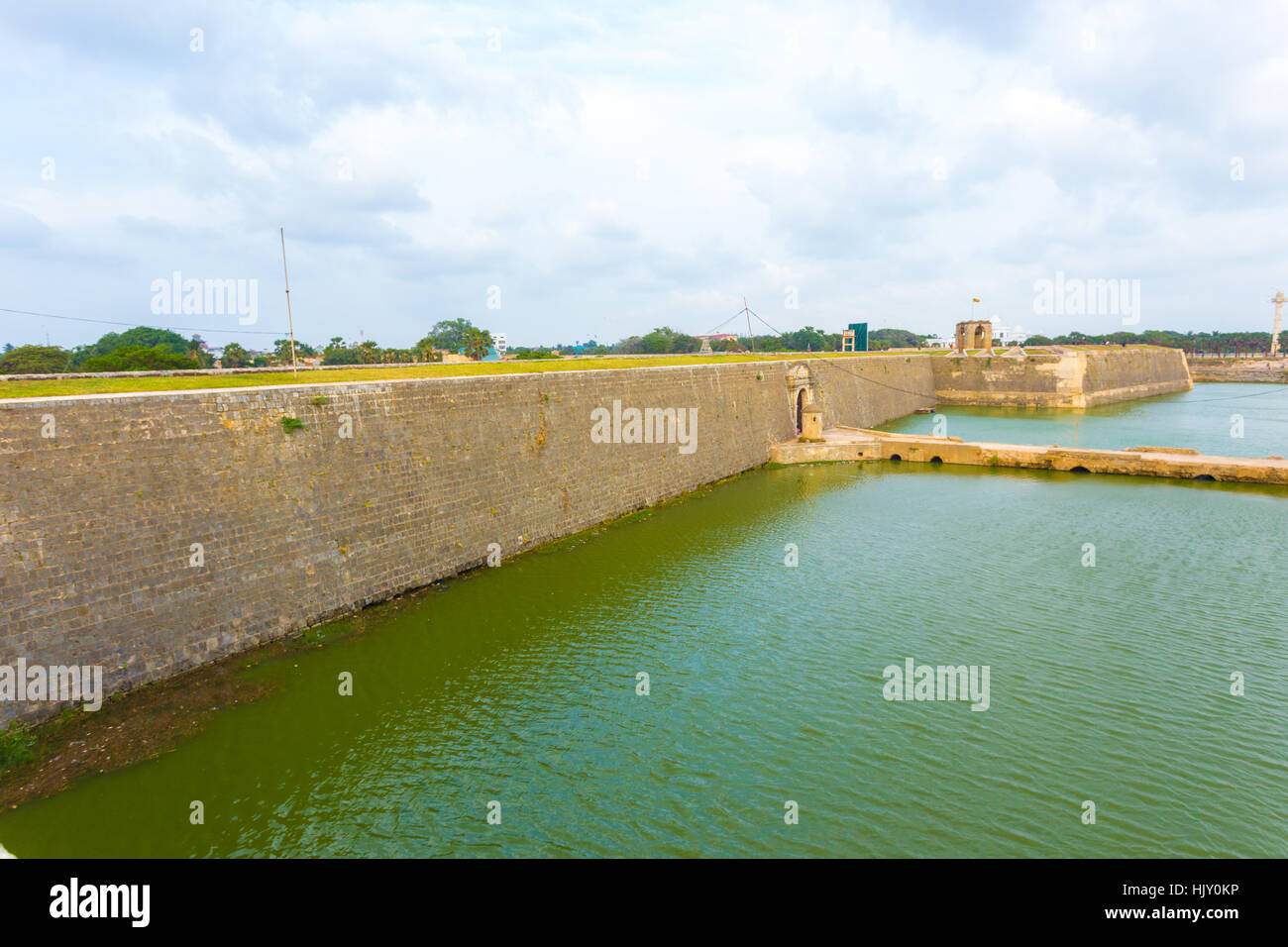 Distant view of entrance and bridge over moat into Jaffna Fort in Sri Lanka. Horizontal Stock Photo