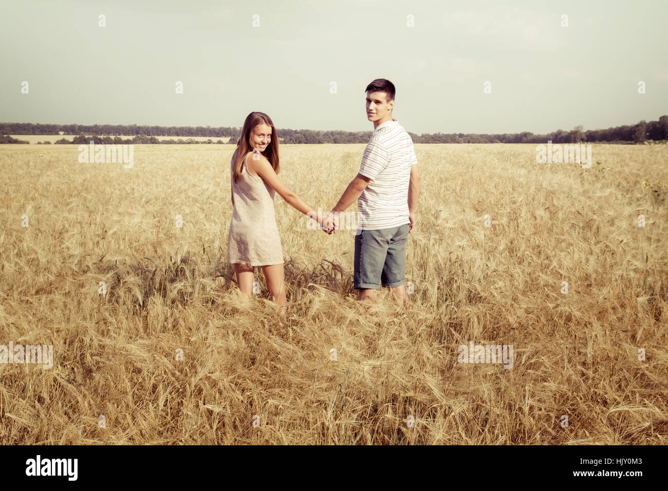 Teen couple walking holding hands hi-res stock photography and images ...