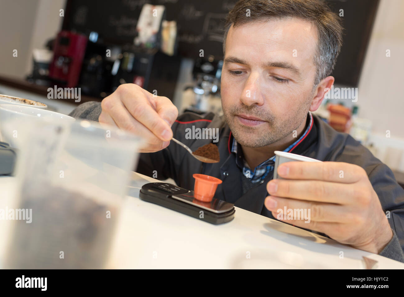 weighing the coffee powder Stock Photo