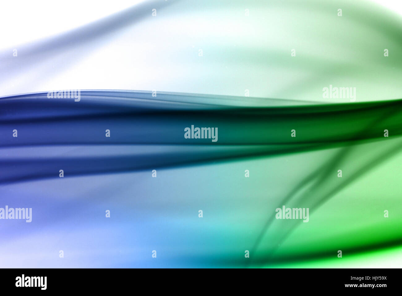 Blue and green smoke in white background Stock Photo - Alamy