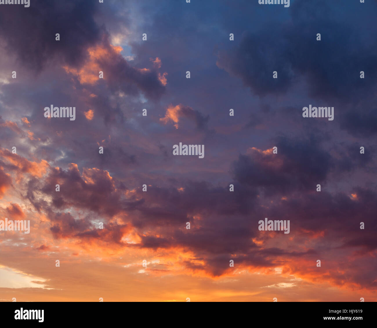 Fiery vivid sunset sky clouds Stock Photo