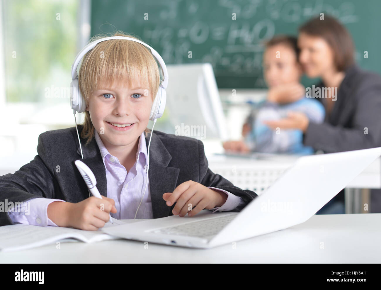 cute little boy using laptop Stock Photo - Alamy