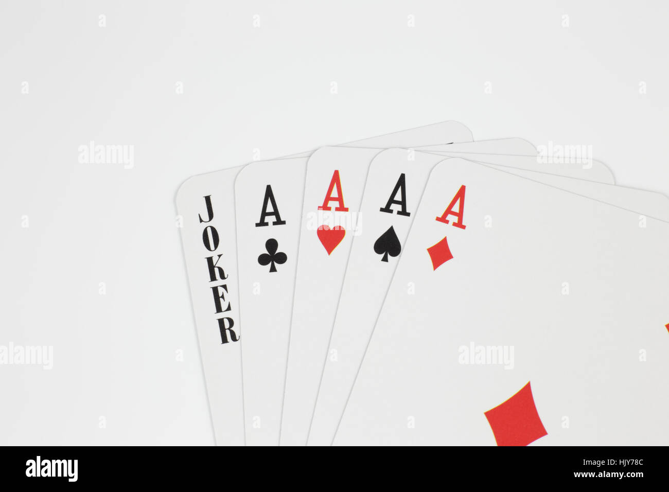 Playing cards - four aces and joker close up isolated in studio Stock Photo  - Alamy