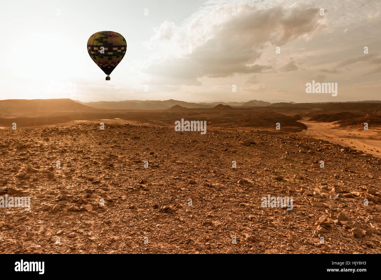 Hot Air Balloon travel over Africa desert Stock Photo