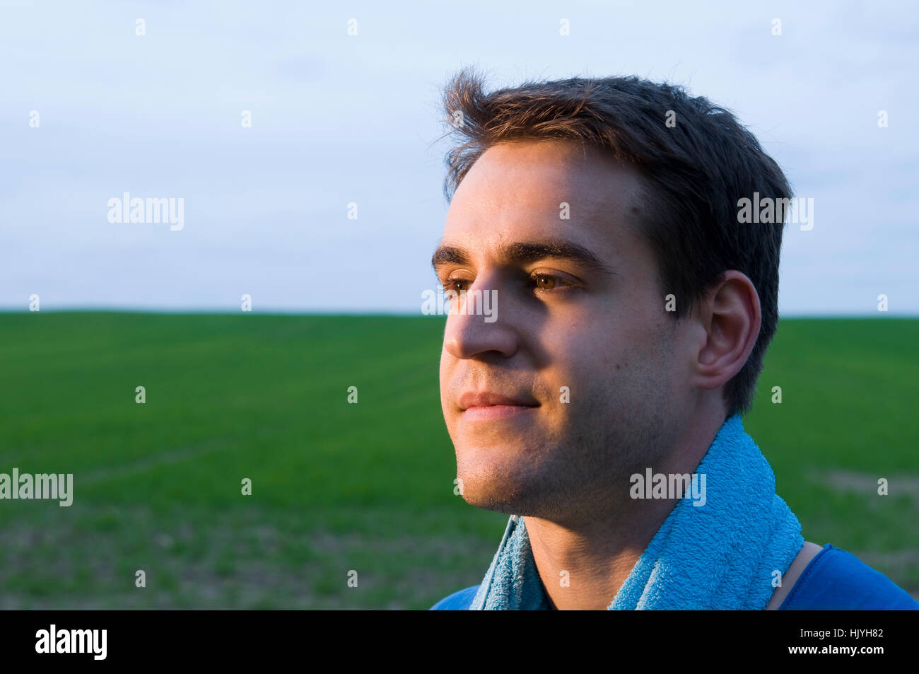 man with blue towel Stock Photo Alamy