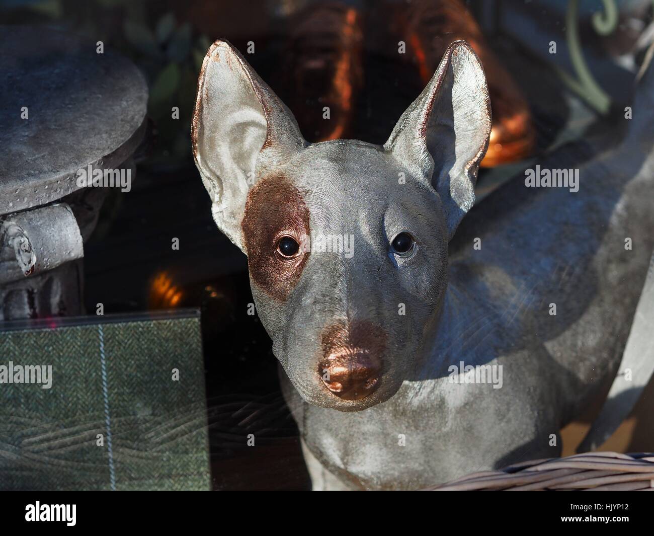 Photo series 'dogs in Berlin' -  A cheese dog figure of a bull terrier is seen in the window of a furniture shop in Berlin on February 15, 2016. Berlin is often called the 'capital of dogs'. This picture is part of a long-term project on dogs in Berlin. Ph | usage worldwide Stock Photo