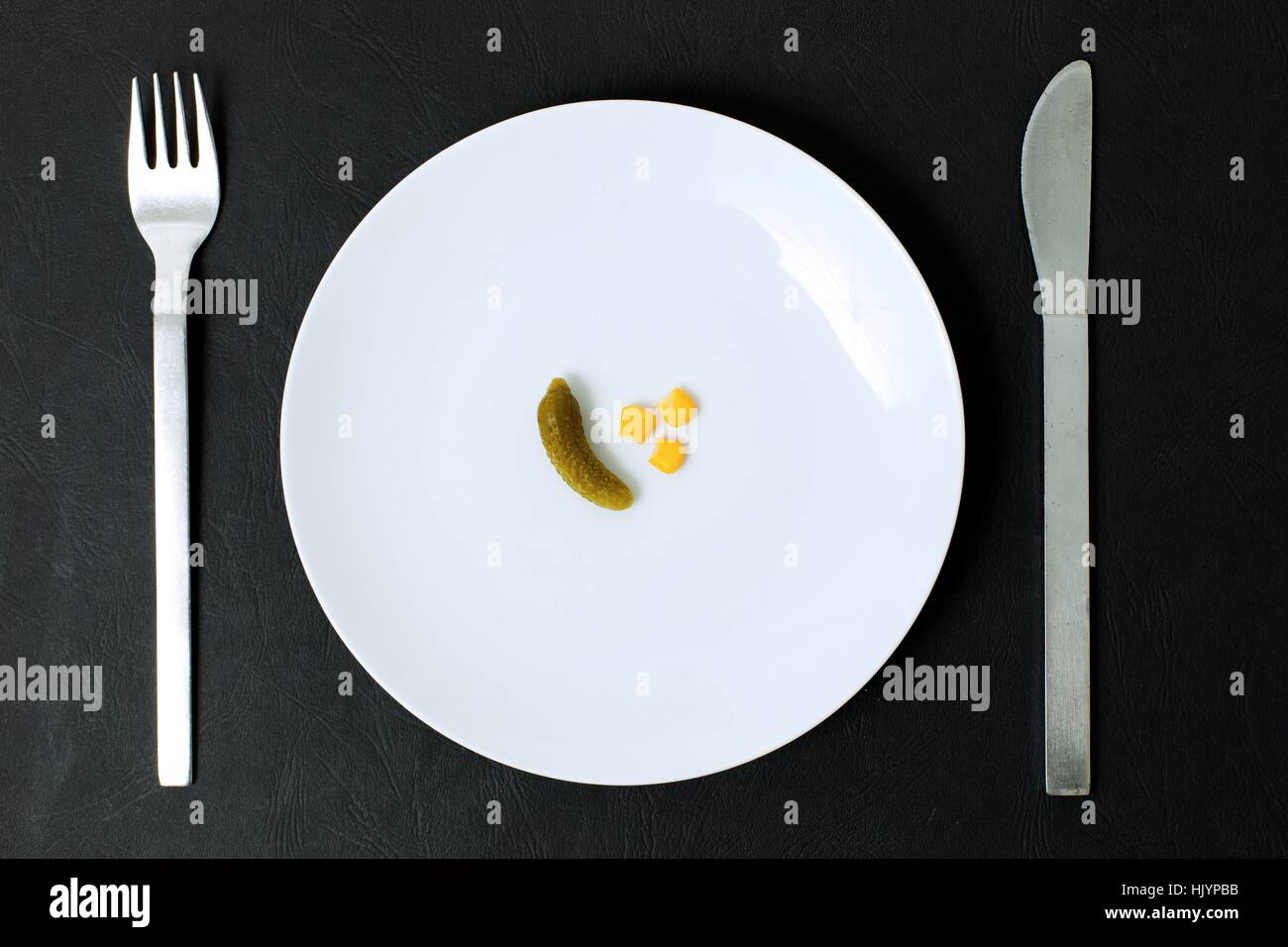 symbol photo for going on a diet - nearly empty plate captured in topview perspective | usage worldwide Stock Photo