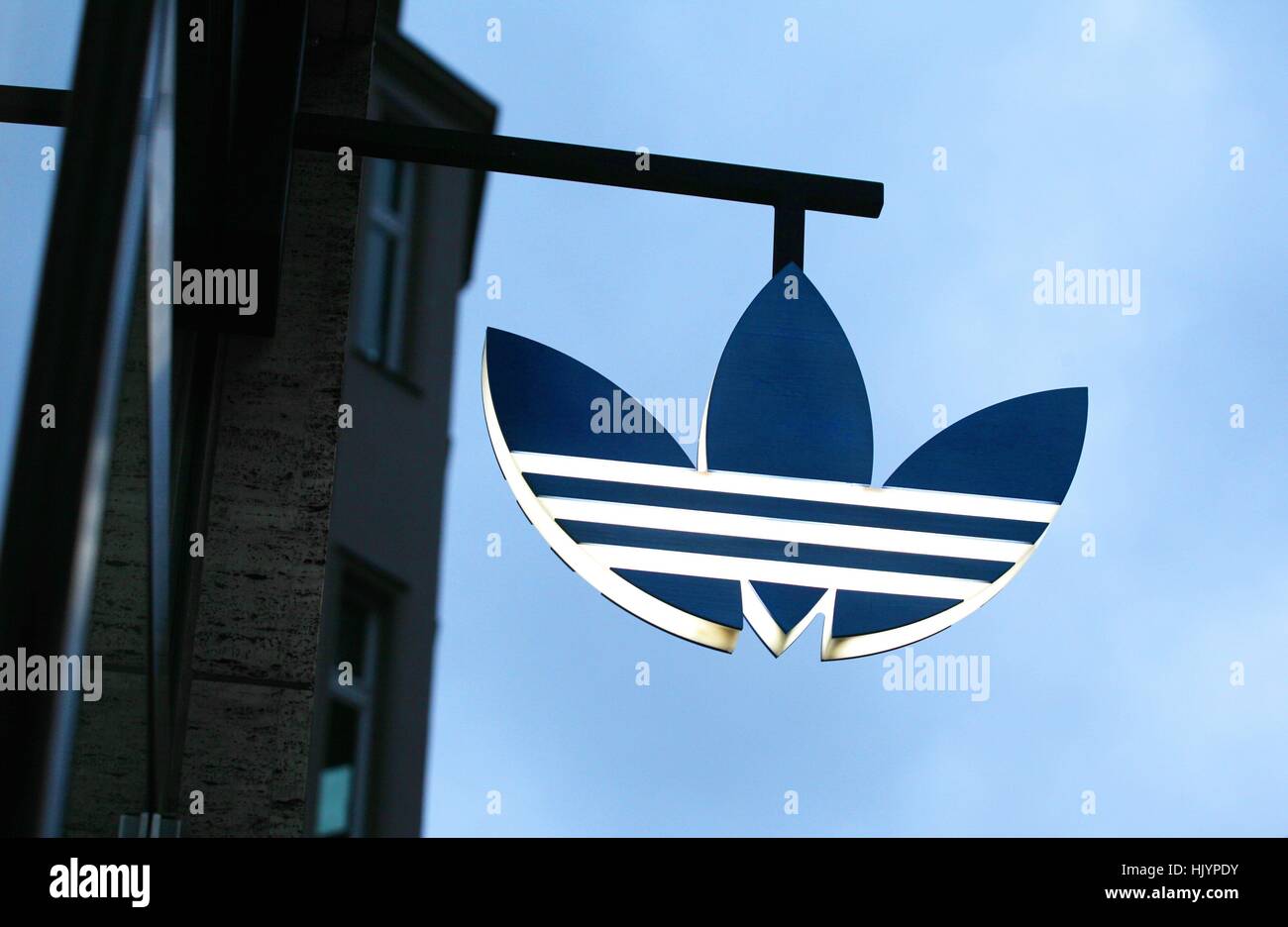 The Adidas logo is seen in Berlin at an Adidas flagstore on December 11,  2016. Photo: Wolfram Steinberg/dpa | usage worldwide Stock Photo - Alamy