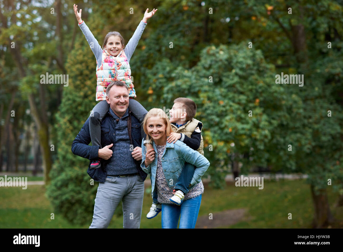 Happy family having fun in the park Stock Photo