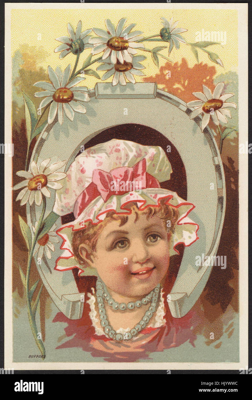 Girl with head through a horseshoe, flowers in forefront. Stock Photo