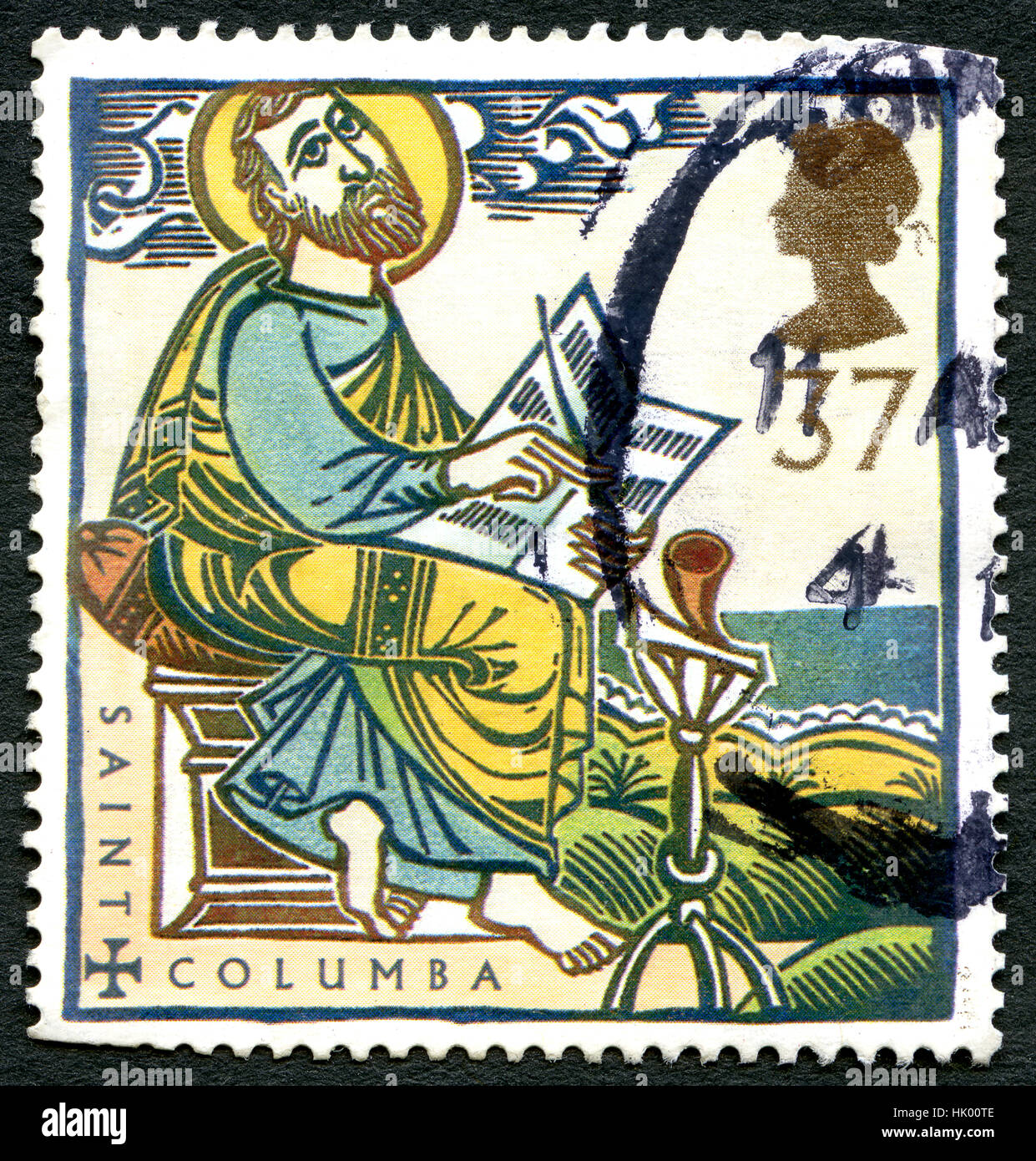 GREAT BRITAIN - CIRCA 1997: A used postage stamp from the UK, celebrating the life of Saint Columba - an Irish Abbot and Missionary credited with spre Stock Photo