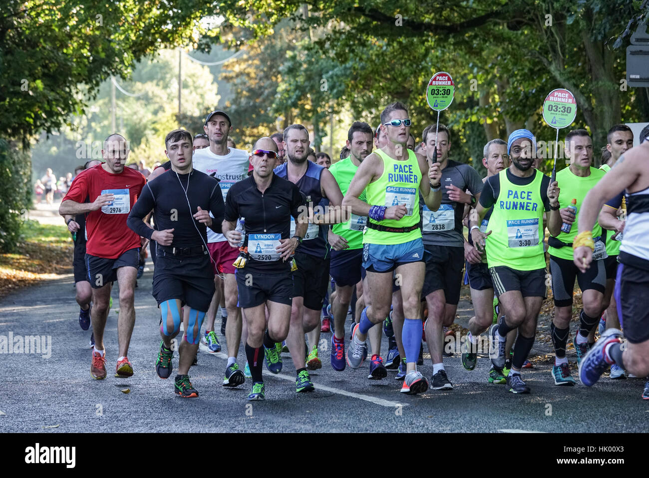 A group of runners in the Chester Marathon stay with the pace runners Stock Photo Alamy