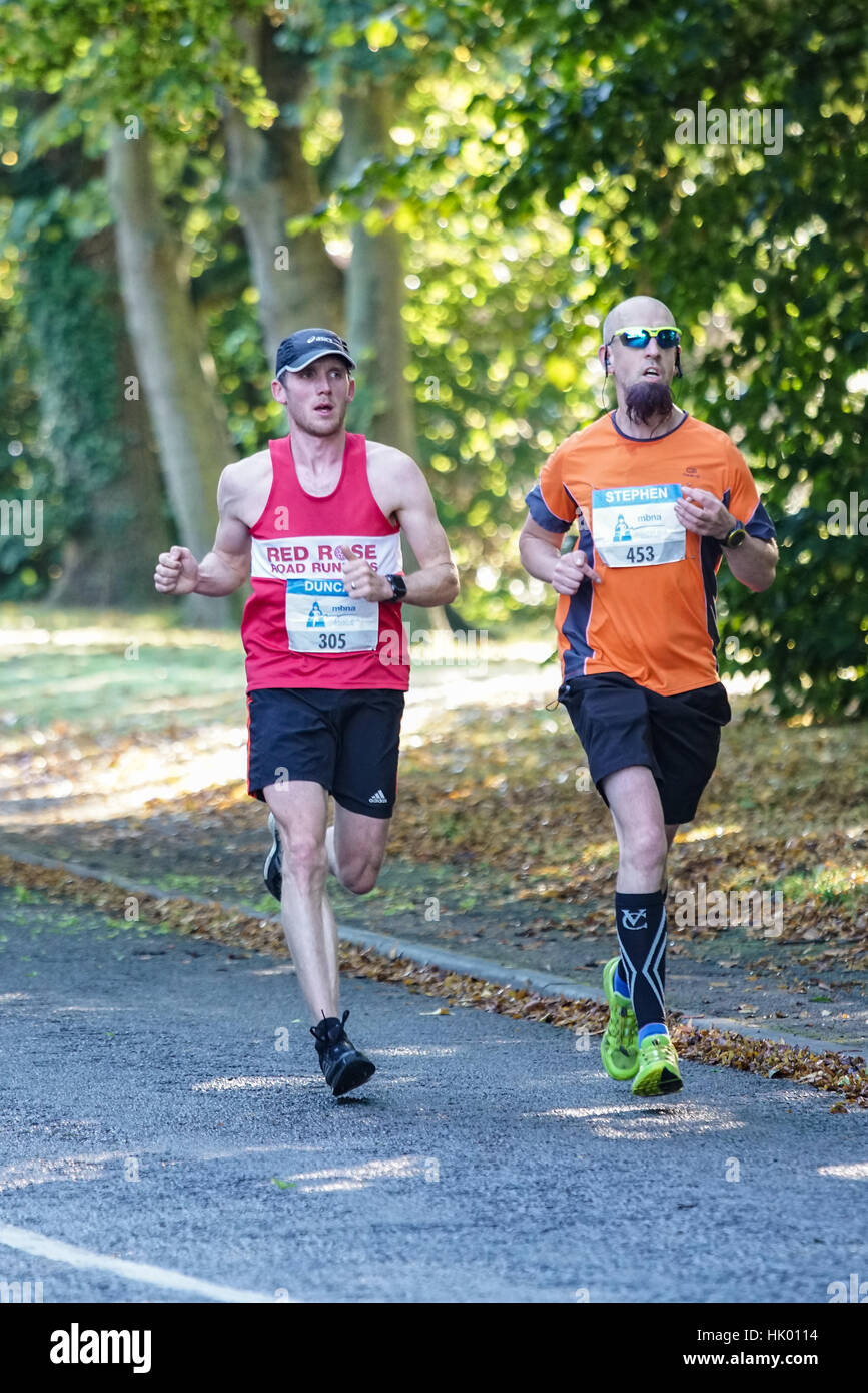 Two runners competing in the Chester Marathon Stock Photo Alamy