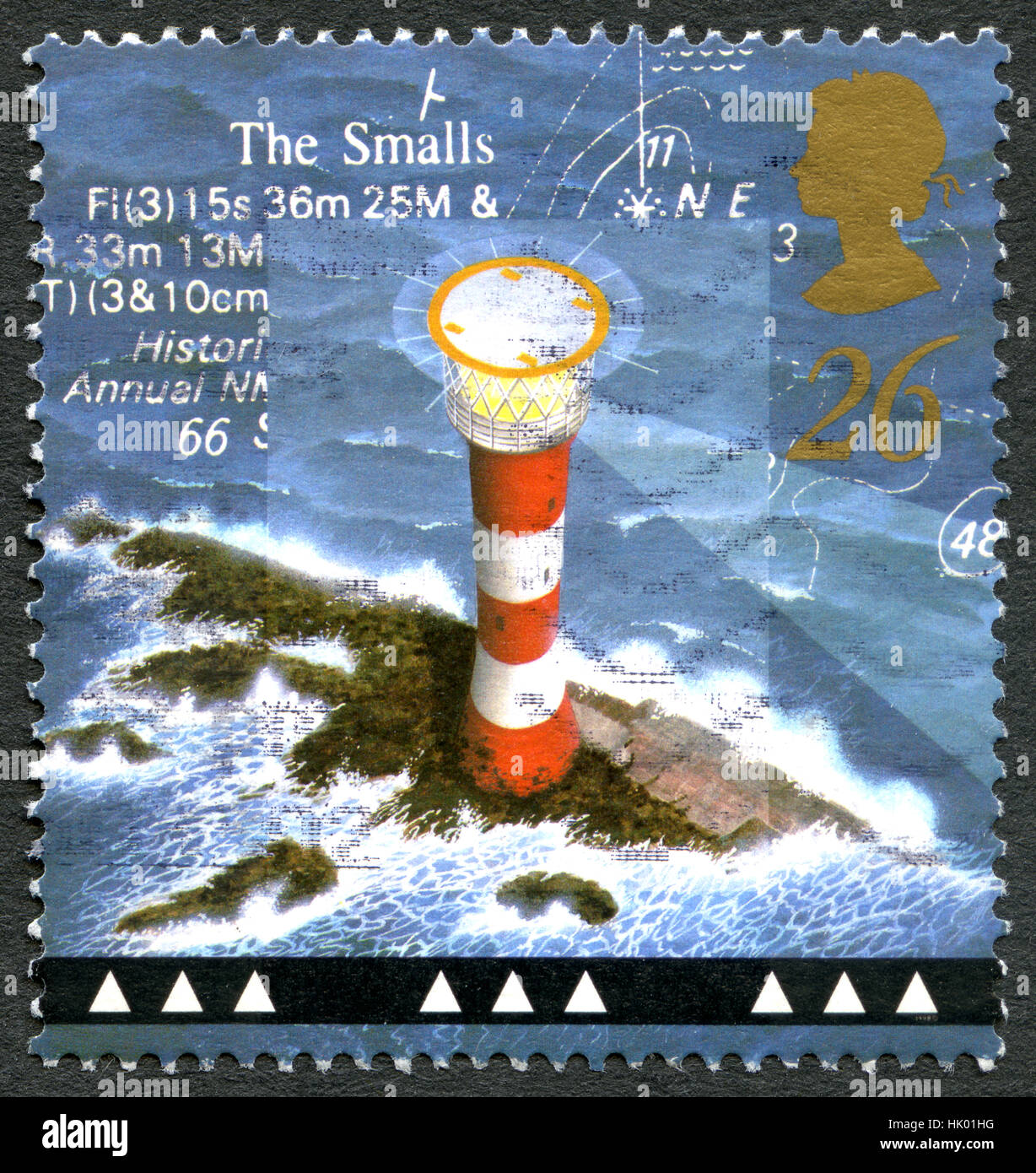 GREAT BRITAIN - CIRCA 1998: A used postage stamp from the UK, depicting an illustration of historic Smalls Lighthouse in Wales, circa 1998. Stock Photo