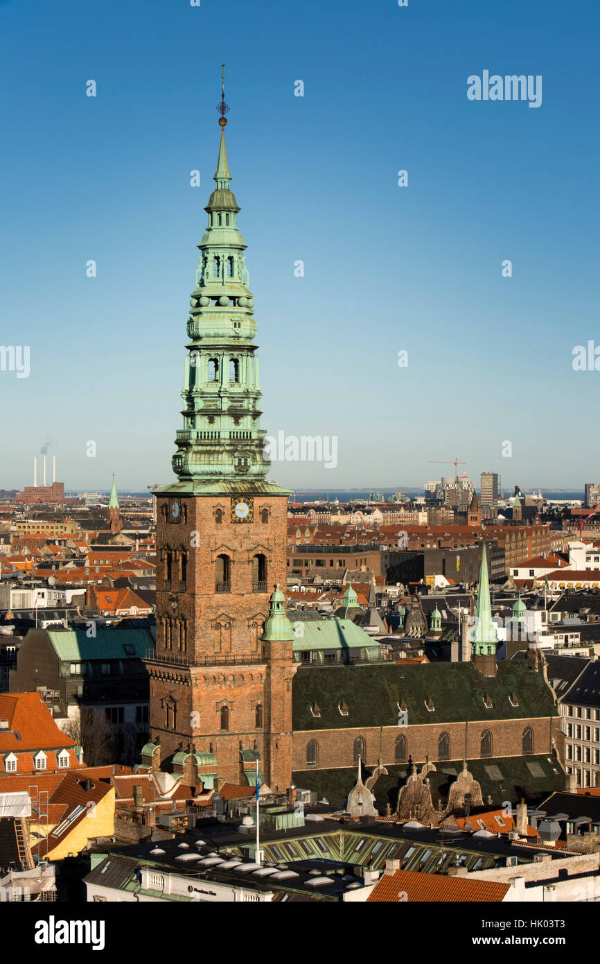 Denmark, Copenhagen, Spire of old Saint Nicolas’ church, now St Nicolaj Kunsthal Contemporary Art Centre, elevated view from Christiansborg Palace tow Stock Photo