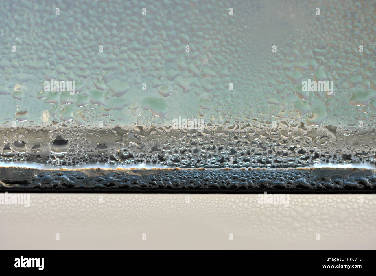 Condensation and damp problem on the inside of a double glazed window. Stock Photo