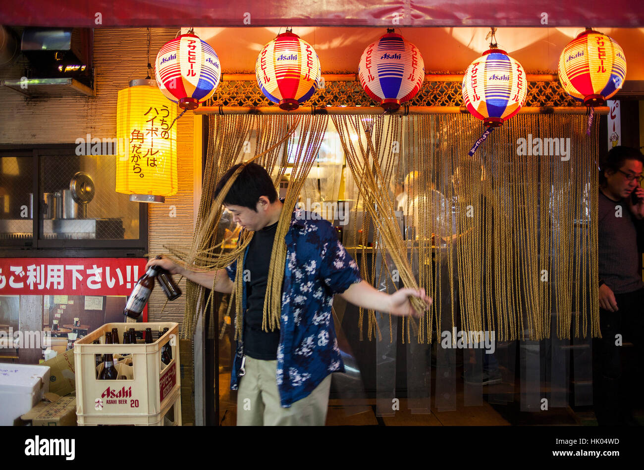 Bartender working, door of  a Izakaya, restaurant, in Ameyoko market Street.Tokyo city, Japan, Asia Stock Photo