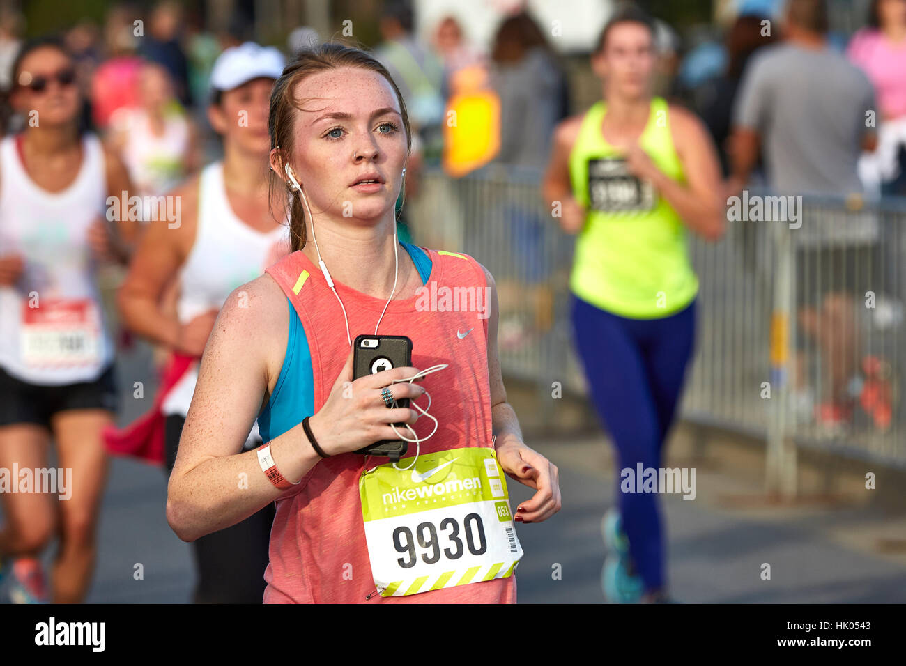 Committed Female Athlete Running In The Nike Woman's Half Marathon, San Francisco, 2015. Stock Photo