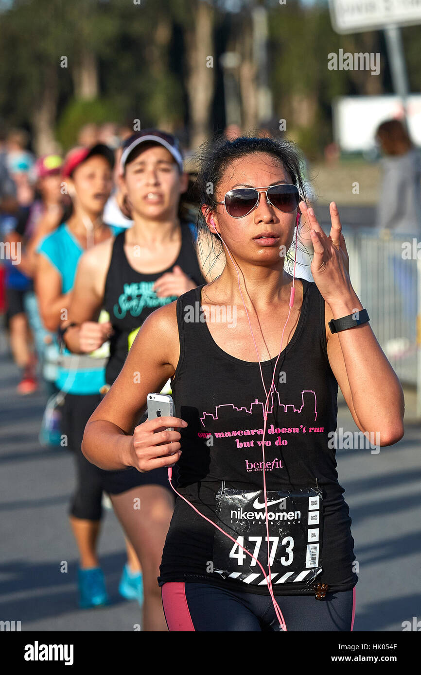 Focused Female Asian Athlete Running In The Nike Woman's Half Marathon, San Francisco, 2015. Stock Photo