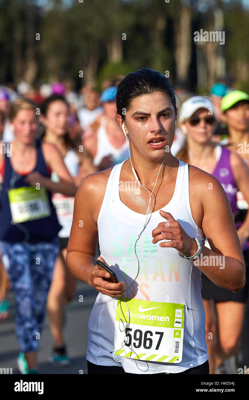 Tired Female Athlete Running In The Nike Woman's Half Marathon, San Francisco, 2015. Stock Photo
