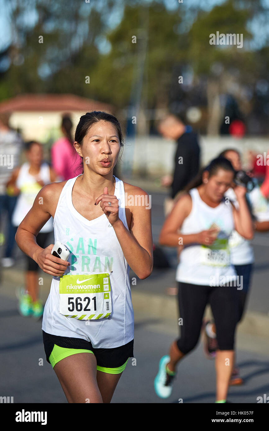 Female Athlete Running In The Nike Woman's Half Marathon, San Francisco, 2015. Stock Photo