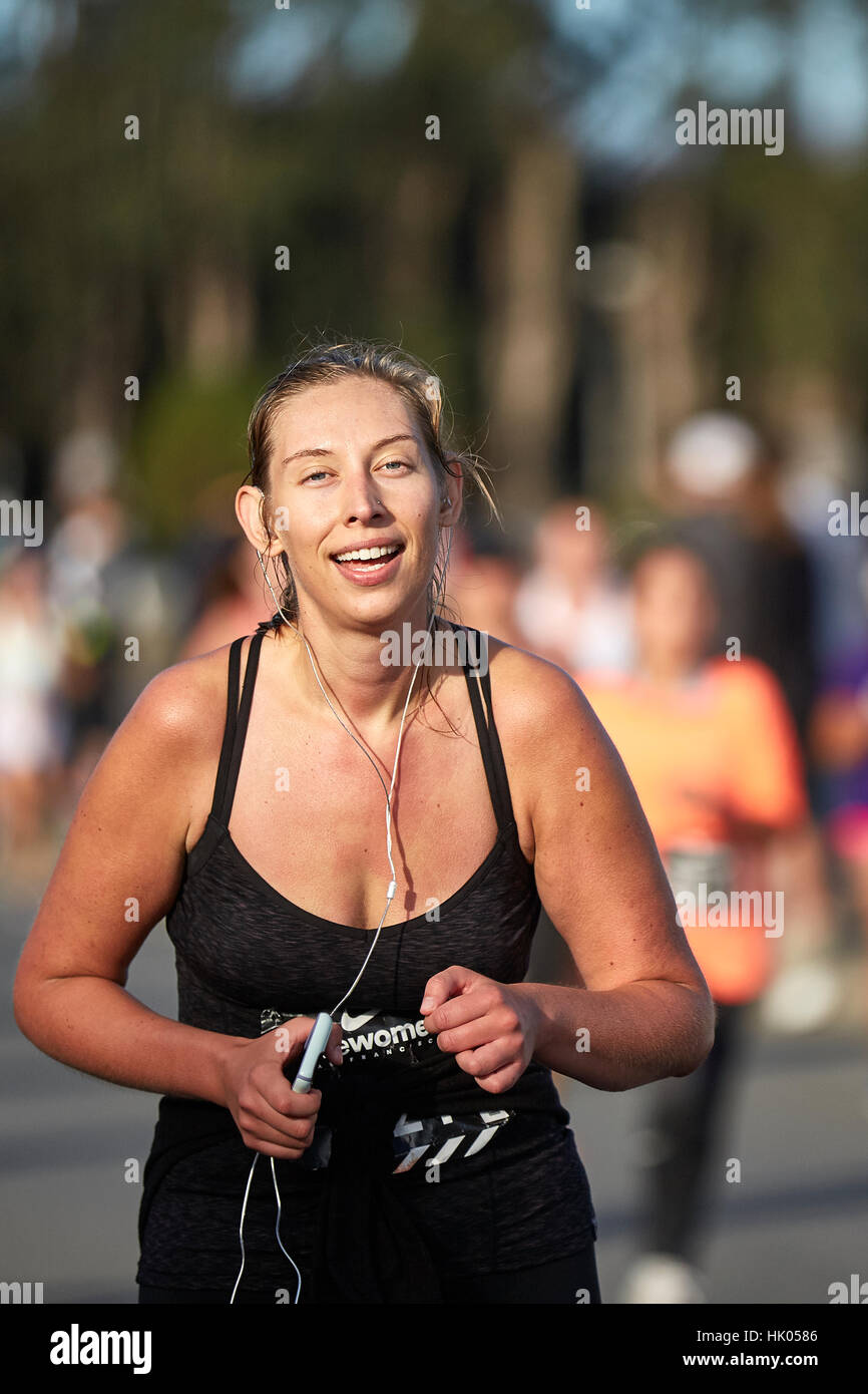 Female Athlete Approaching The Finish Line In The Nike Woman's Half Marathon, San Francisco, 2015. Stock Photo