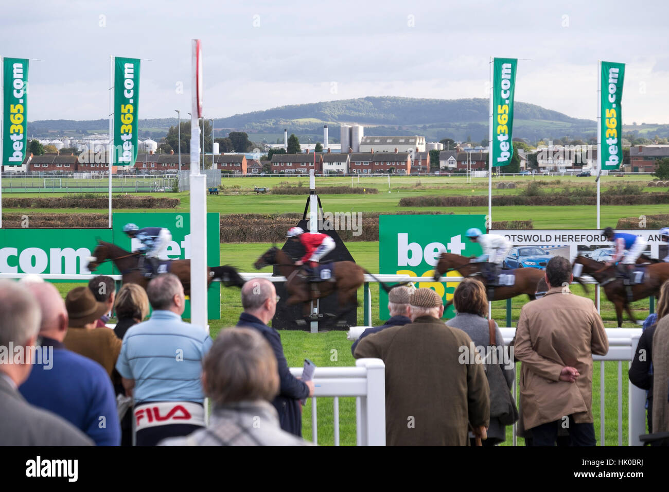 Finishing line and crowd at horse racing event Stock Photo