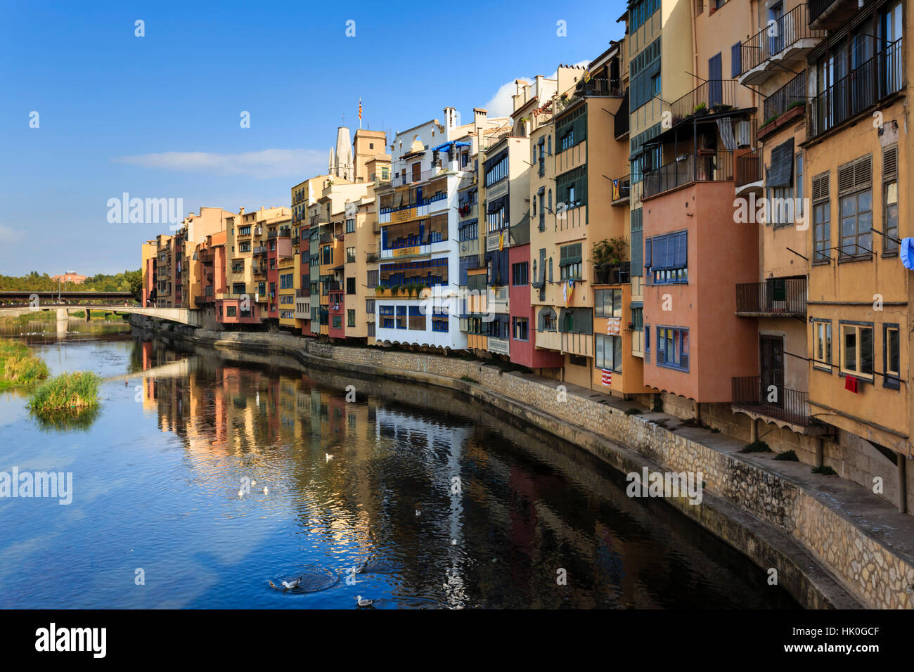 Distinctive historic colourful arcaded houses and Onyar River, Girona