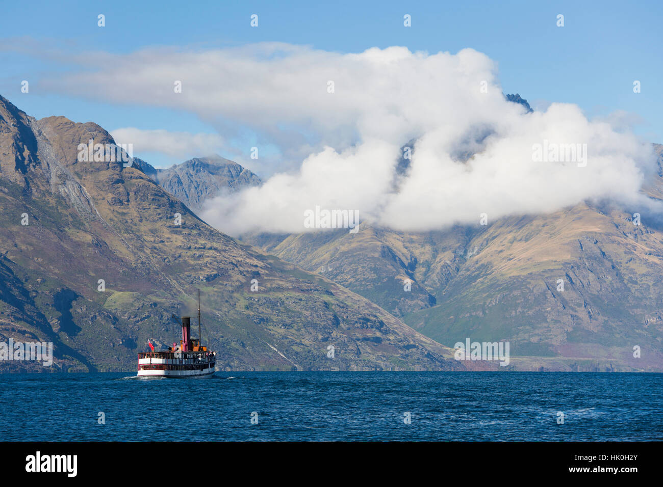 The steamship TSS Earnslaw on Lake Wakatipu, clouds over Walter Peak, Queenstown, Queenstown-Lakes district, Otago, New Zealand Stock Photo
