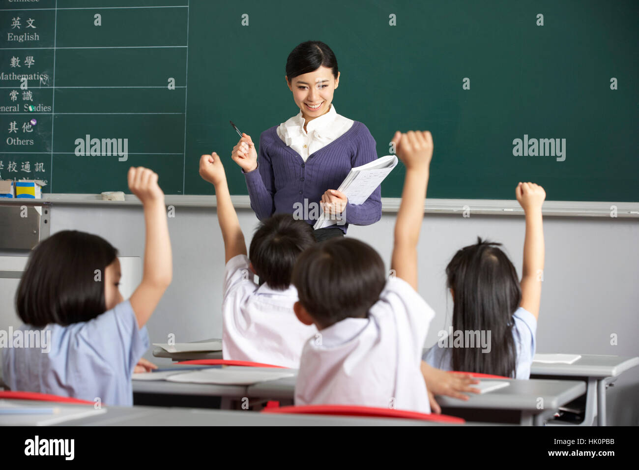 Teacher With Students In Chinese School Classroom Stock Photo Alamy