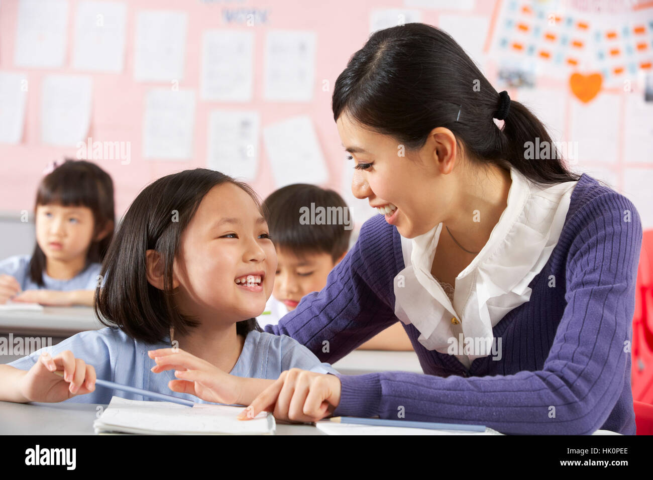 Teacher encouraging school boy hi-res stock photography and images - Alamy