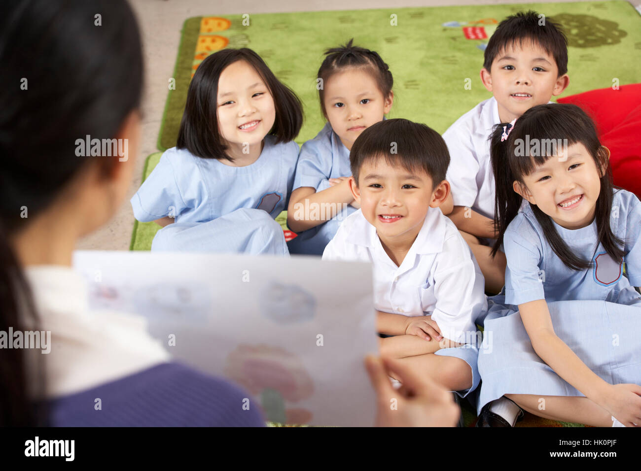 Teacher Showing Painting To Students In Chinese School Classroom Stock ...