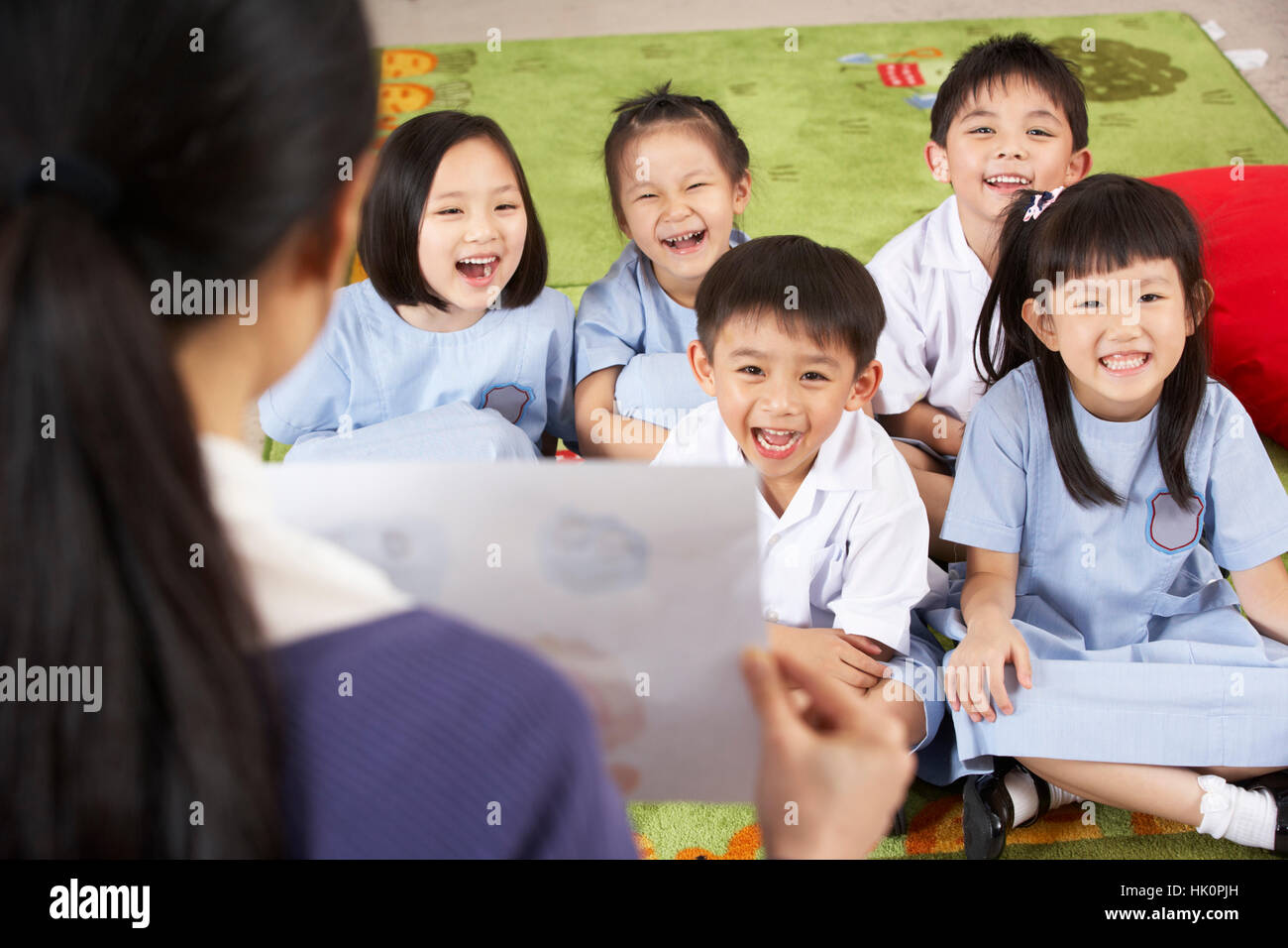 Teacher Showing Painting To Students In Chinese School Classroom Stock ...