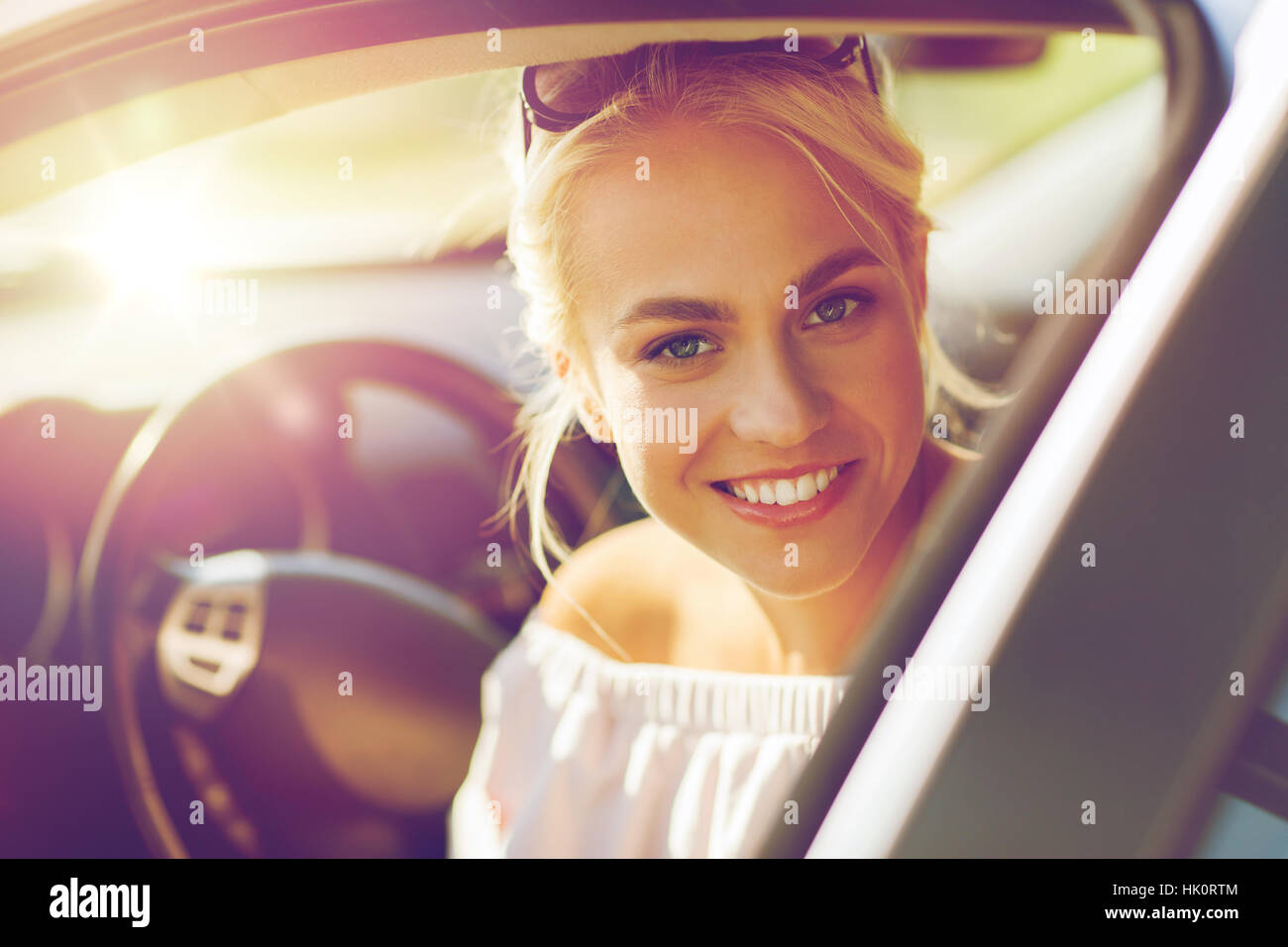 happy teenage girl or young woman in car Stock Photo - Alamy