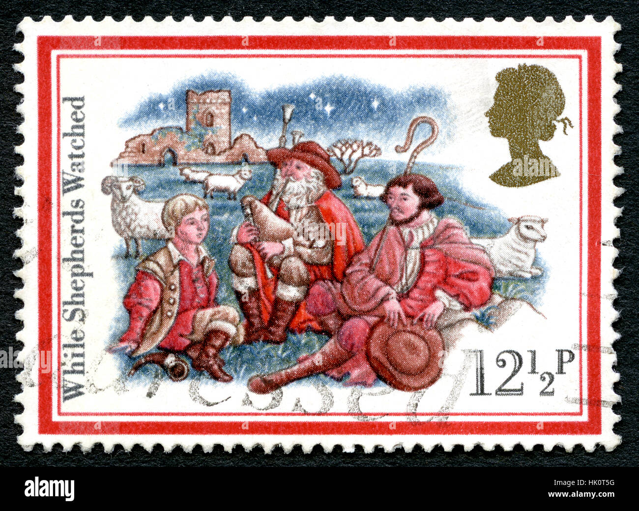 UK - CIRCA 1982: A used postage stamp from the UK, commemorating Christmas Carols with the title While Shepherds Watched. Stock Photo