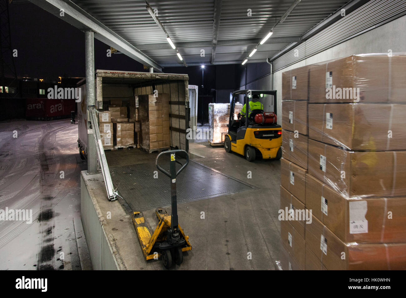 Loading a truck on the ramp Stock Photo - Alamy