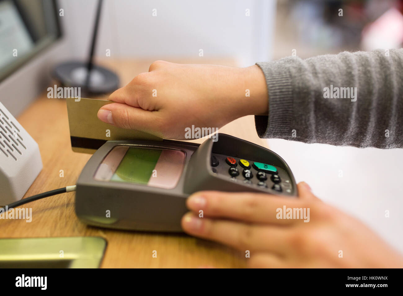 close up of hand inserting bank card to terminal Stock Photo - Alamy