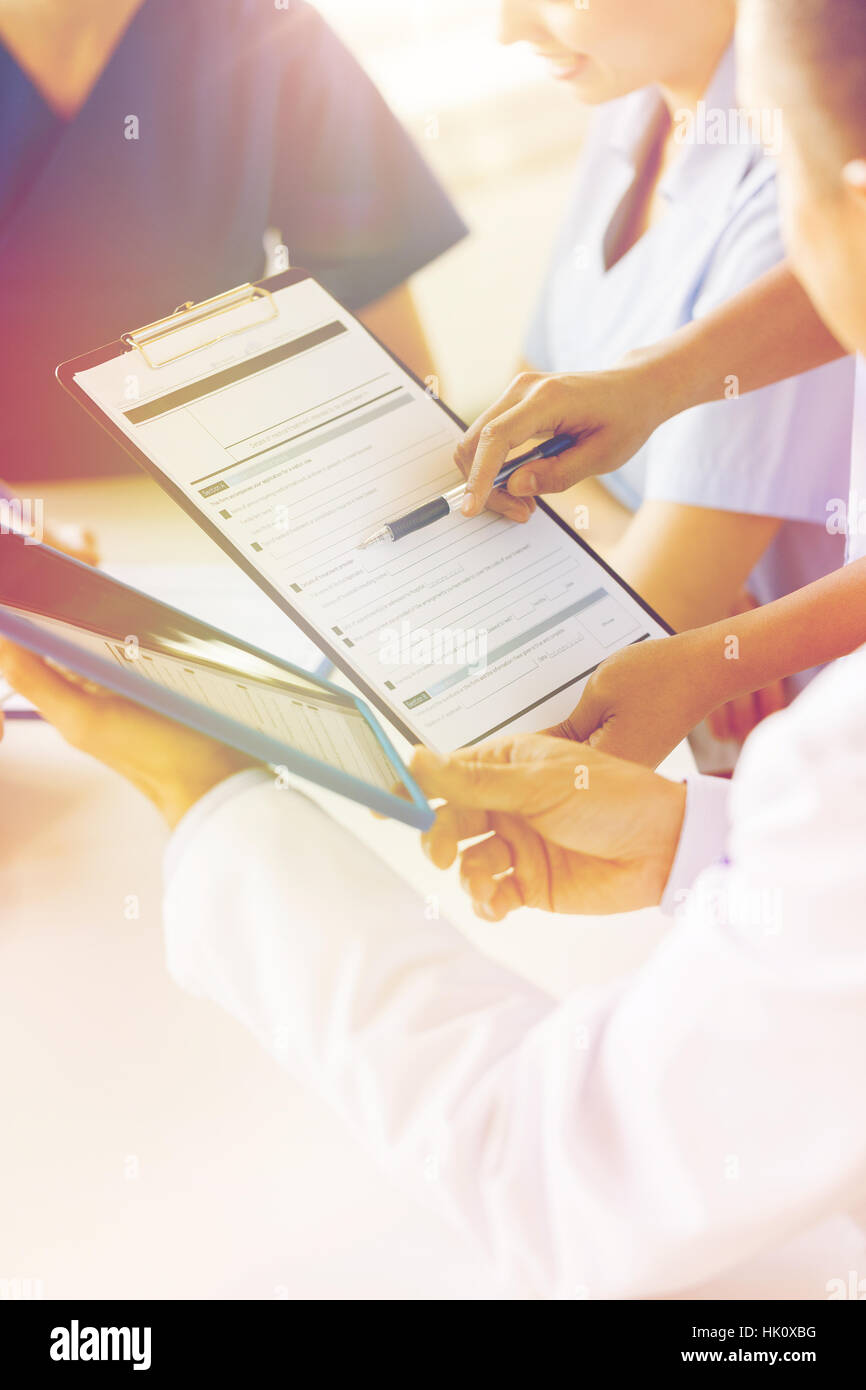 close up of doctors with clipboard at hospital Stock Photo - Alamy