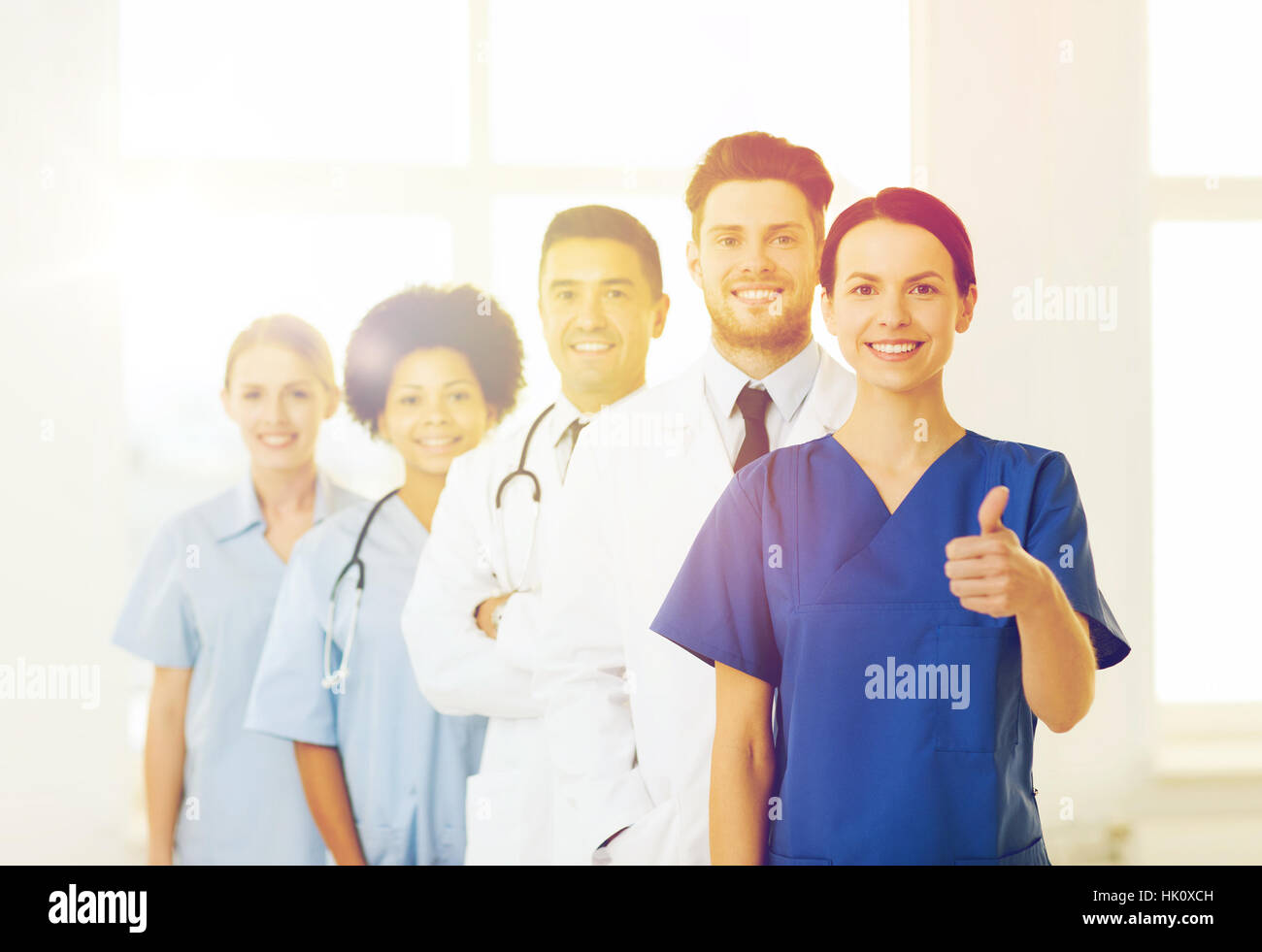 happy doctors showing thumbs up at hospital Stock Photo - Alamy