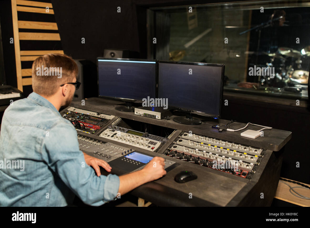 man at mixing console in music recording studio Stock Photo - Alamy