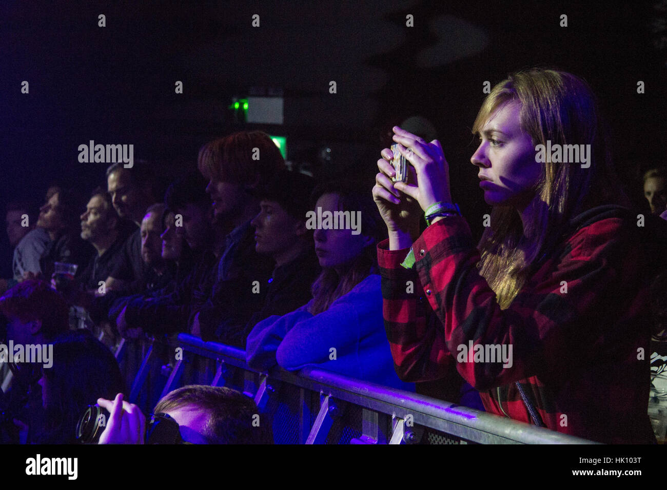 CARDIFF, UNITED KINGDOM. Girl in Crowd filming Max Raptor performing on ...