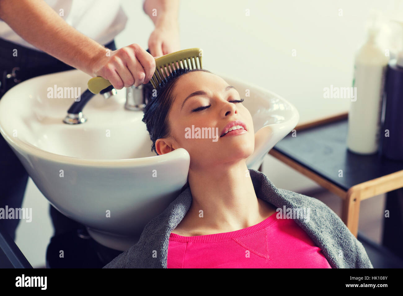 happy young woman at hair salon Stock Photo