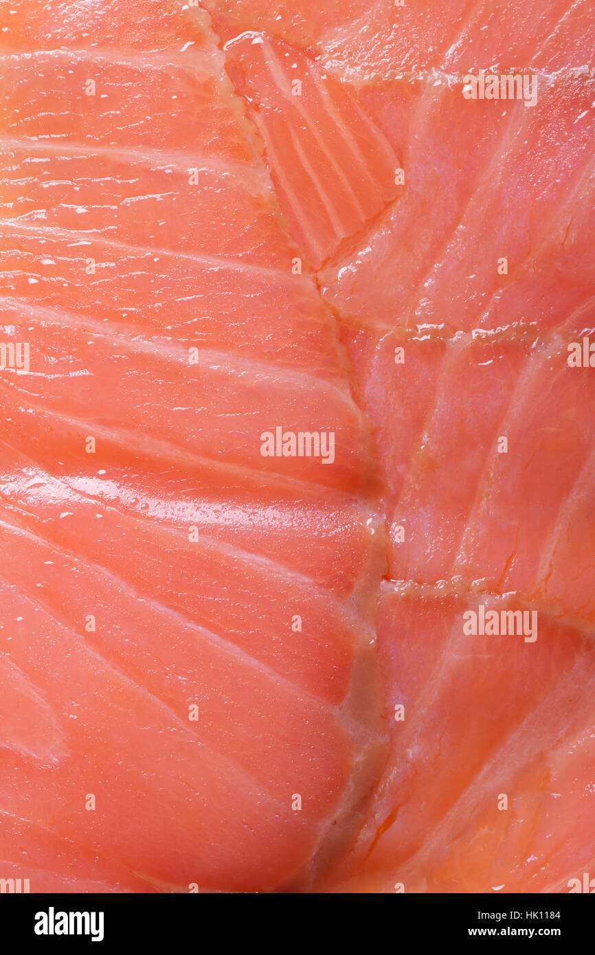 Salmon fillet macro vertical. Food background of red fish Stock Photo
