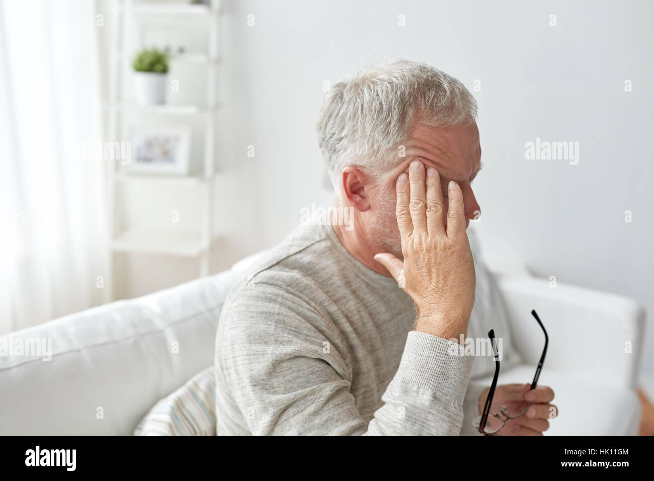 senior man suffering from headache at home Stock Photo - Alamy