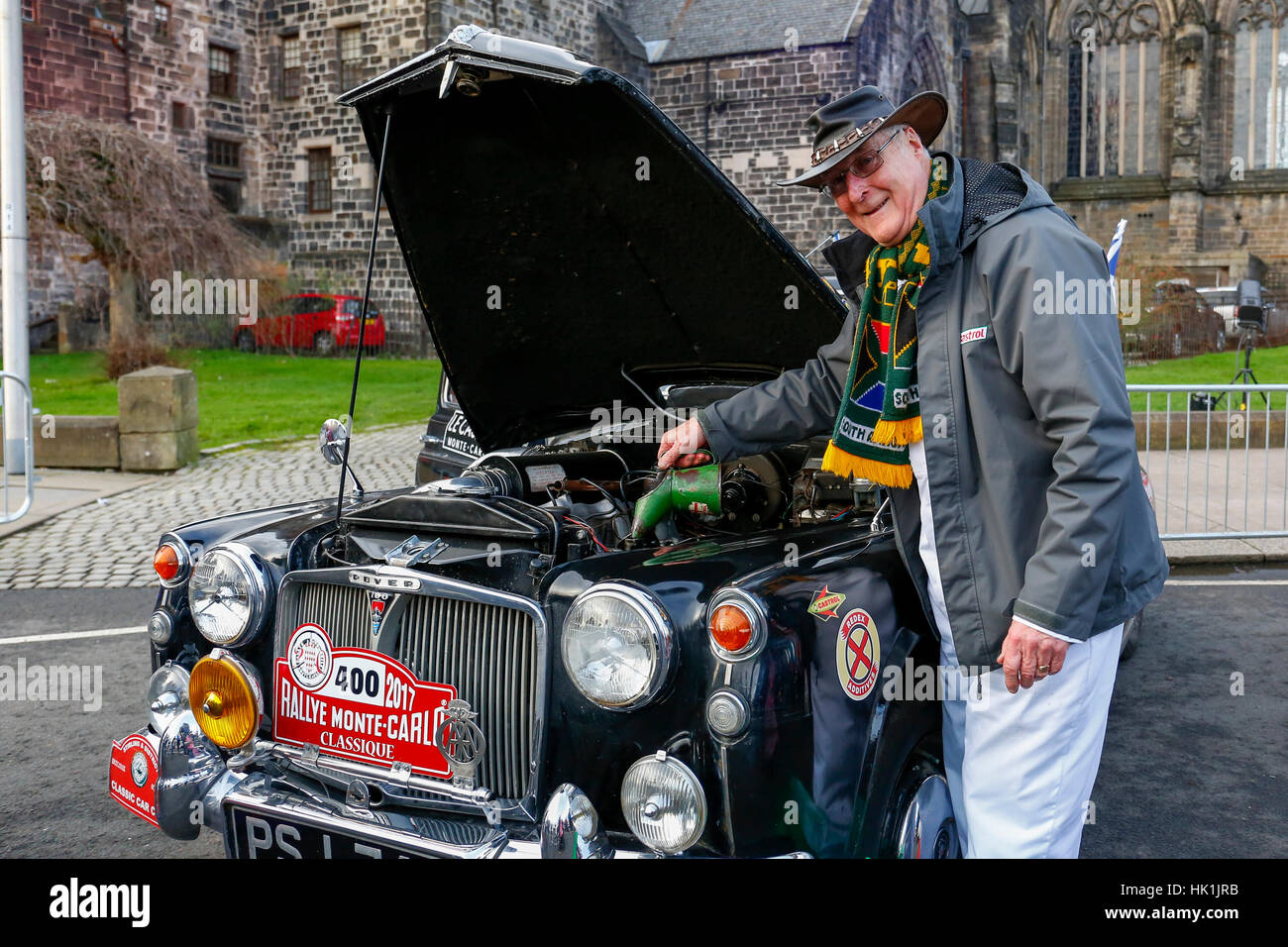 Paisley, Scotland, UK. 25th January 2017. Over 10000 spectators turned out in Paisley town centre, outside the town's famous historical abbey to cheer off the 80 entrants to this years Monte Carlo Rally.  This image is of GORDON BEST from Alva, Scotland preparing his 1960 Rover P4-100 before the race begins Credit: Findlay/Alamy Live News Stock Photo