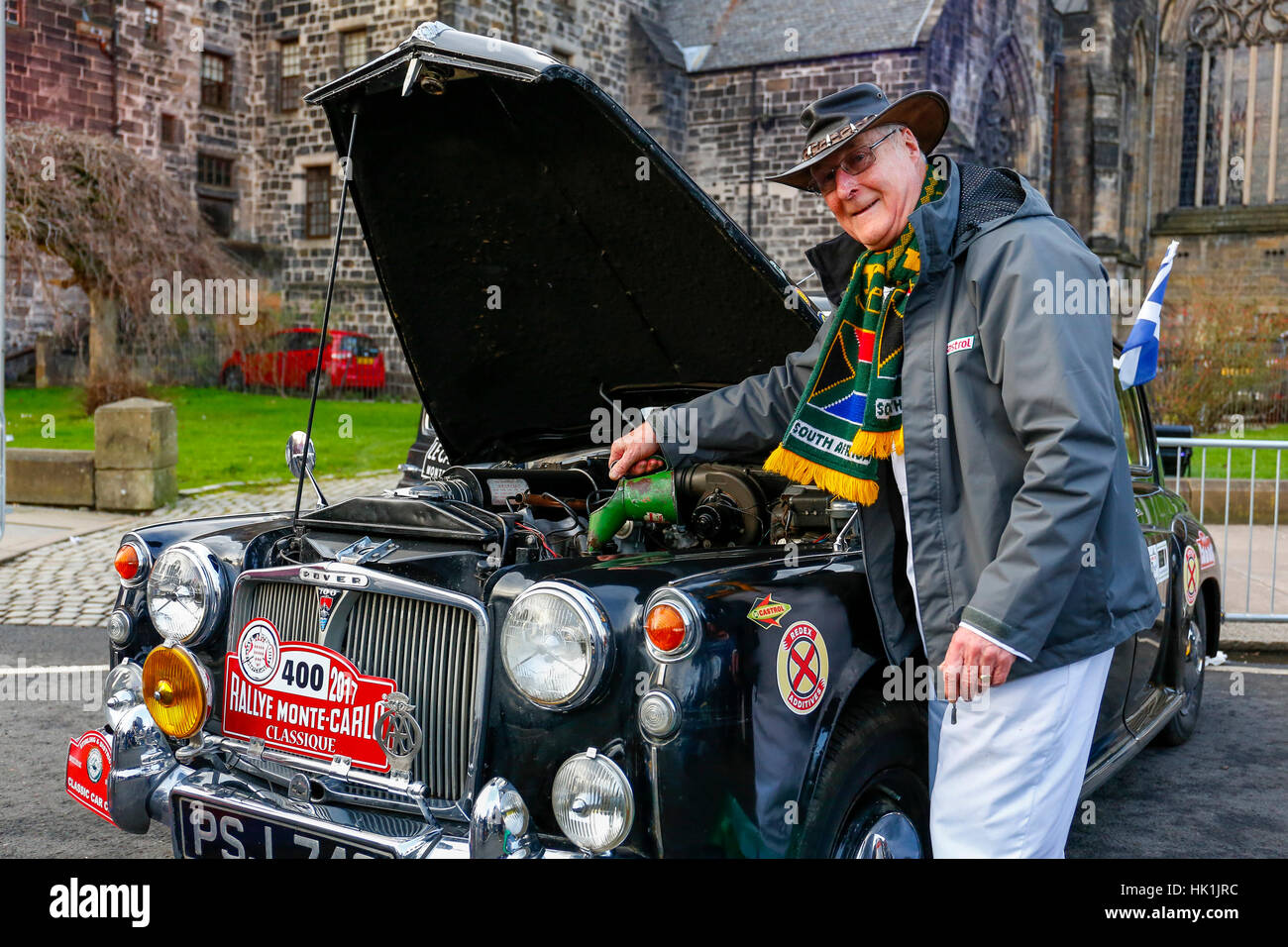 Paisley, Scotland, UK. 25th January 2017. Over 10000 spectators turned out in Paisley town centre, outside the town's famous historical abbey to cheer off the 80 entrants to this years Monte Carlo Rally. This image is of GORDON BEST from Alva, Scotland preparing his 1960 Rover  P4-100 before the race begins Credit: Findlay/Alamy Live News Stock Photo